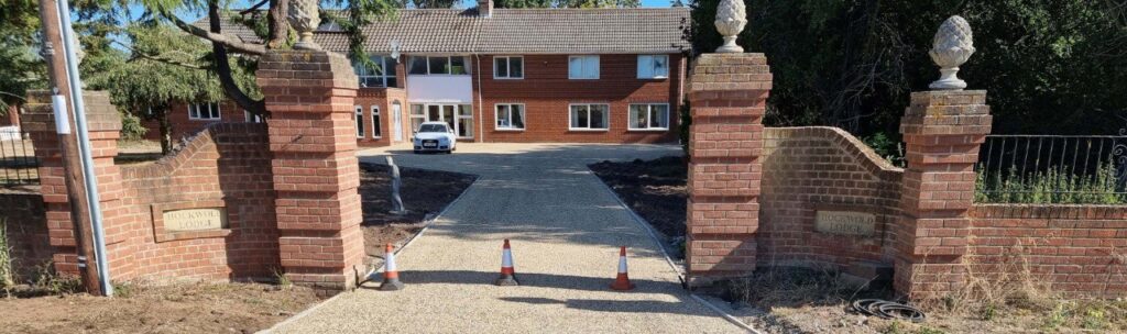 This is a photo of a newly installed chip and tar driveway, installed by Soham Driveways
